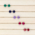 Flatlay view of Solitaire 1.6ct CZ Cartilage Stud Earrings in Sterling Silver, Amethyst
