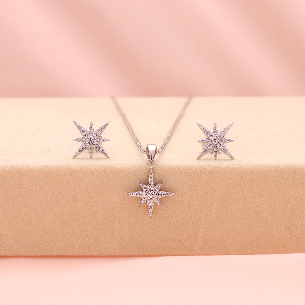 Flatlay view of North Star CZ Necklace and Earrings in Sterling Silver, Yellow Gold Flashed