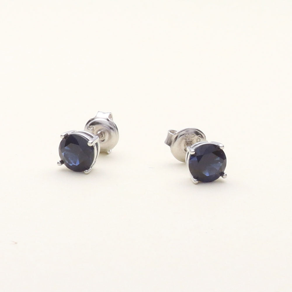 Flatlay view of Solitaire 1.6ct CZ Cartilage Stud Earrings in Sterling Silver, Sapphire Color