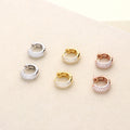 Flatlay view of Dome CZ Mini Cartilage Huggie Earrings in Sterling Silver 0.5 inch