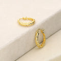 Flatlay view of Filigree Medium Hoop Earrings in Sterling Silver 0.75 inch, Yellow Gold Flashed