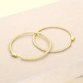 Flatlay view of CZ Large Inside-Out Hoop Earrings in Sterling Silver 2 inch, Yellow Gold Flashed