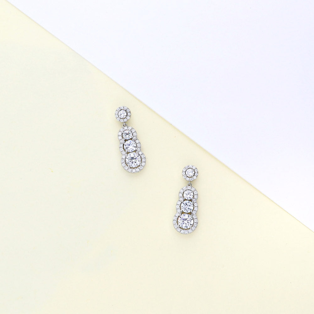 Flatlay view of Graduated Halo CZ Earrings in Sterling Silver, 5 of 6