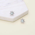 Flatlay view of Sun Sunburst Simulated Opal CZ Stud Earrings in Sterling Silver, Yellow Gold Flashed