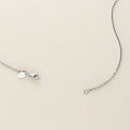 Flatlay view of Italian Layered Rolo Chain Necklace in Sterling Silver, 3-Piece, Rhodium Plated / 16-20 inch