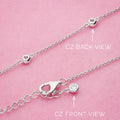 Flatlay view of Station CZ Station Necklace in Sterling Silver, Yellow Gold Flashed / 16 inch + 2 inch extension