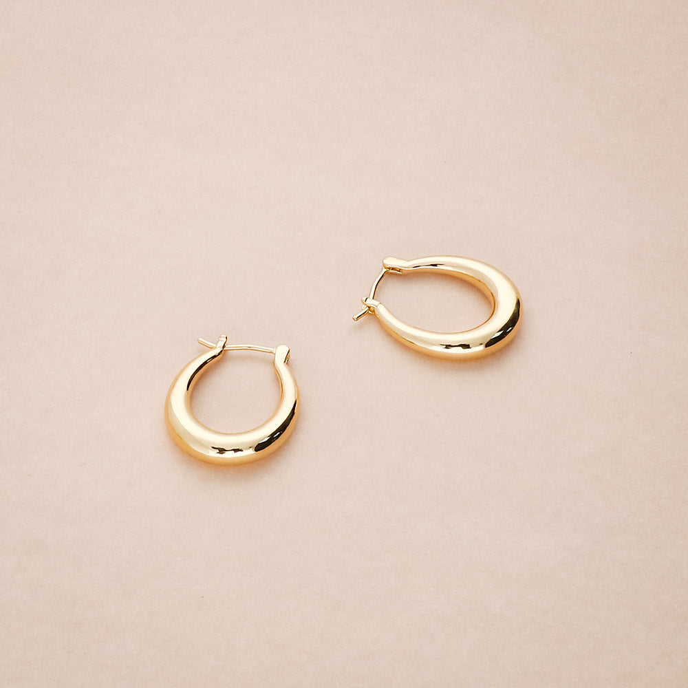Flatlay view of Oval Small Hoop Earrings 0.9 inch, Gold-Tone