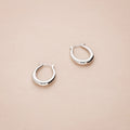 Flatlay view of Oval Medium Hoop Earrings 0.9 inch, Silver-Tone