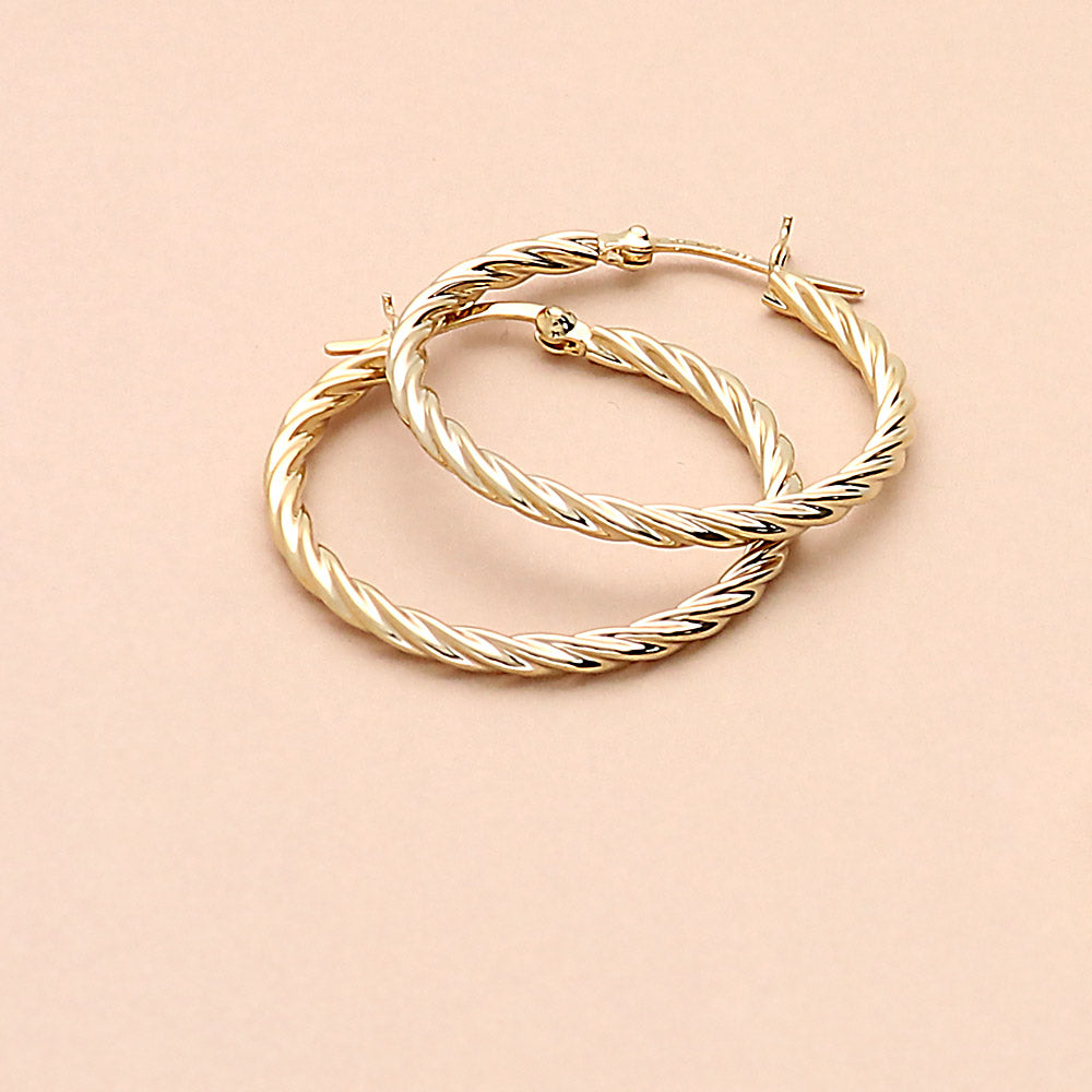 Flatlay view of Cable Hoop Earrings in Sterling Silver 1.2 inch, Yellow Gold Flashed