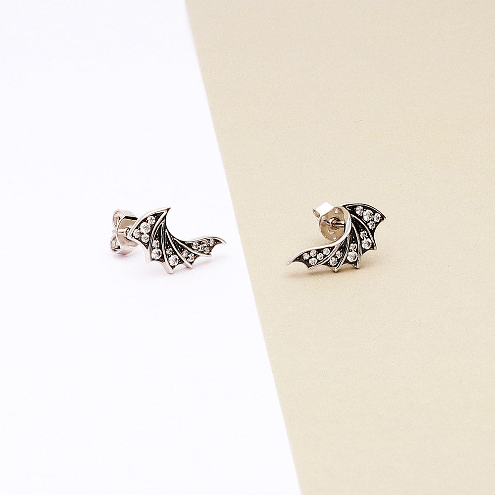 Flatlay view of Angel Wings CZ Stud Earrings in Sterling Silver, 2 of 4