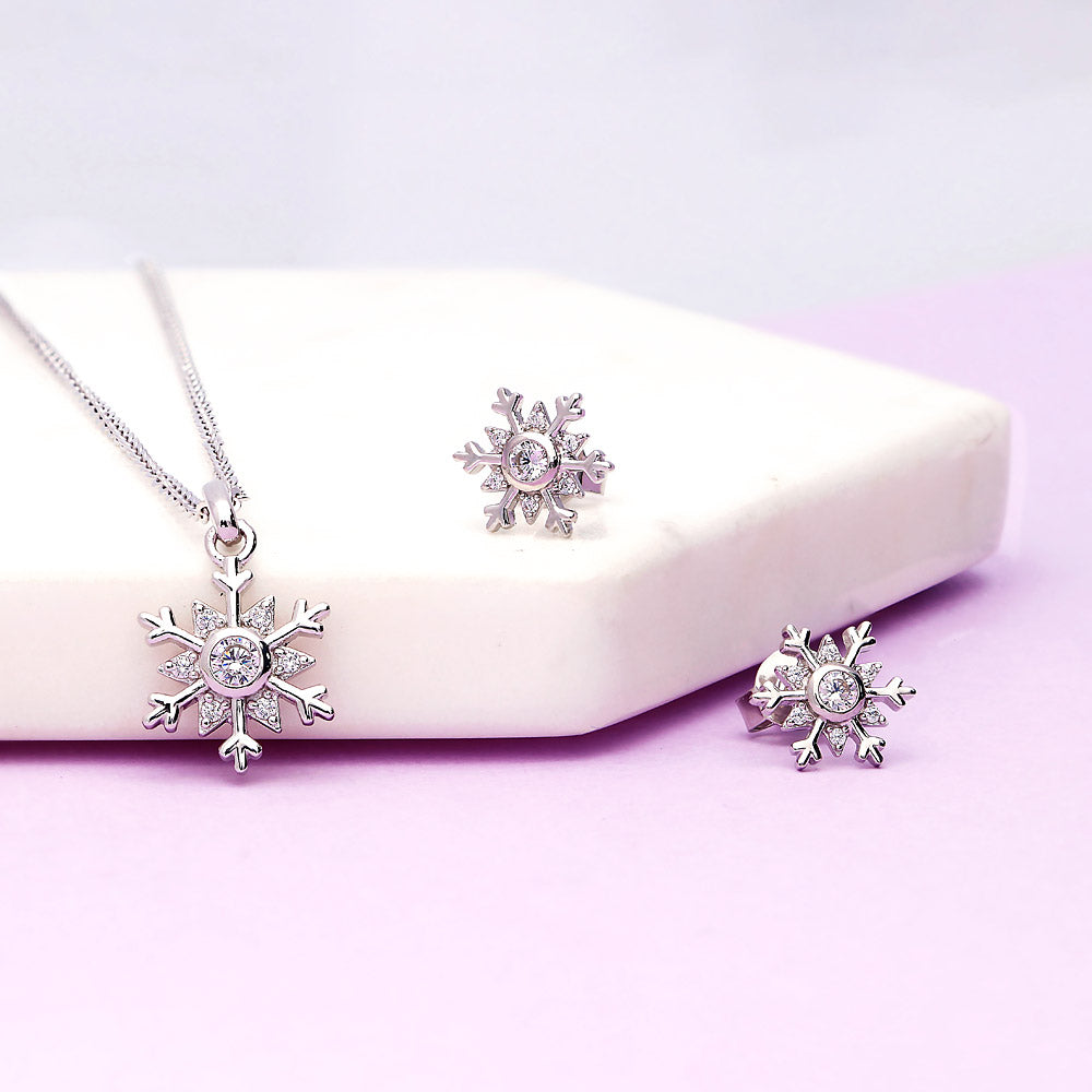 Flatlay view of Snowflake CZ Necklace and Earrings in Sterling Silver, 2 of 7