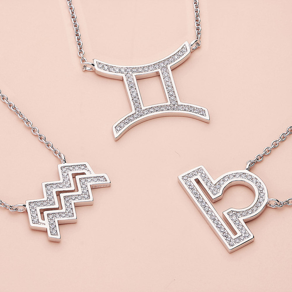Flatlay view of Zodiac CZ Pendant Necklace in Sterling Silver, Aquarius