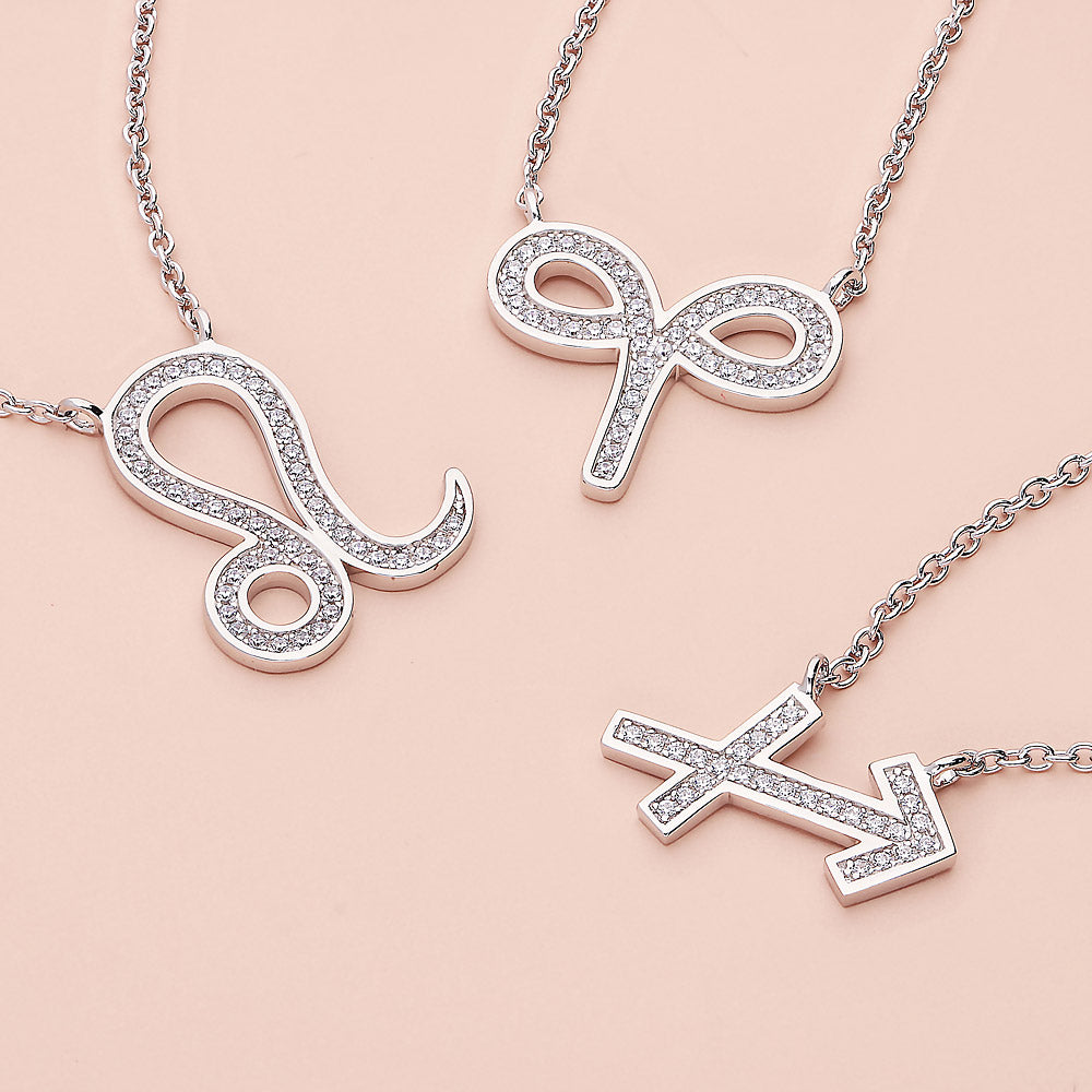 Flatlay view of Zodiac CZ Pendant Necklace in Sterling Silver, Aquarius