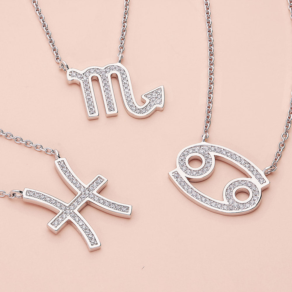 Flatlay view of Zodiac CZ Pendant Necklace in Sterling Silver, Aquarius