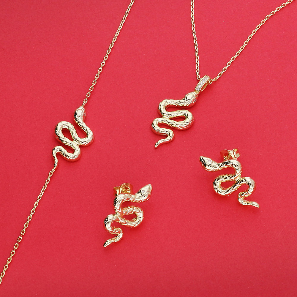Flatlay view of Snake CZ Rolo Chain Bracelet in Sterling Silver, Yellow Gold Flashed