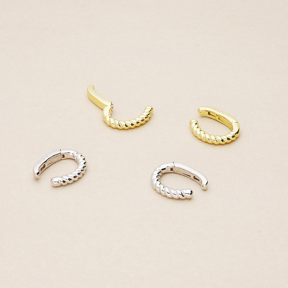 Flatlay view of Cable Ear Cuffs in Sterling Silver