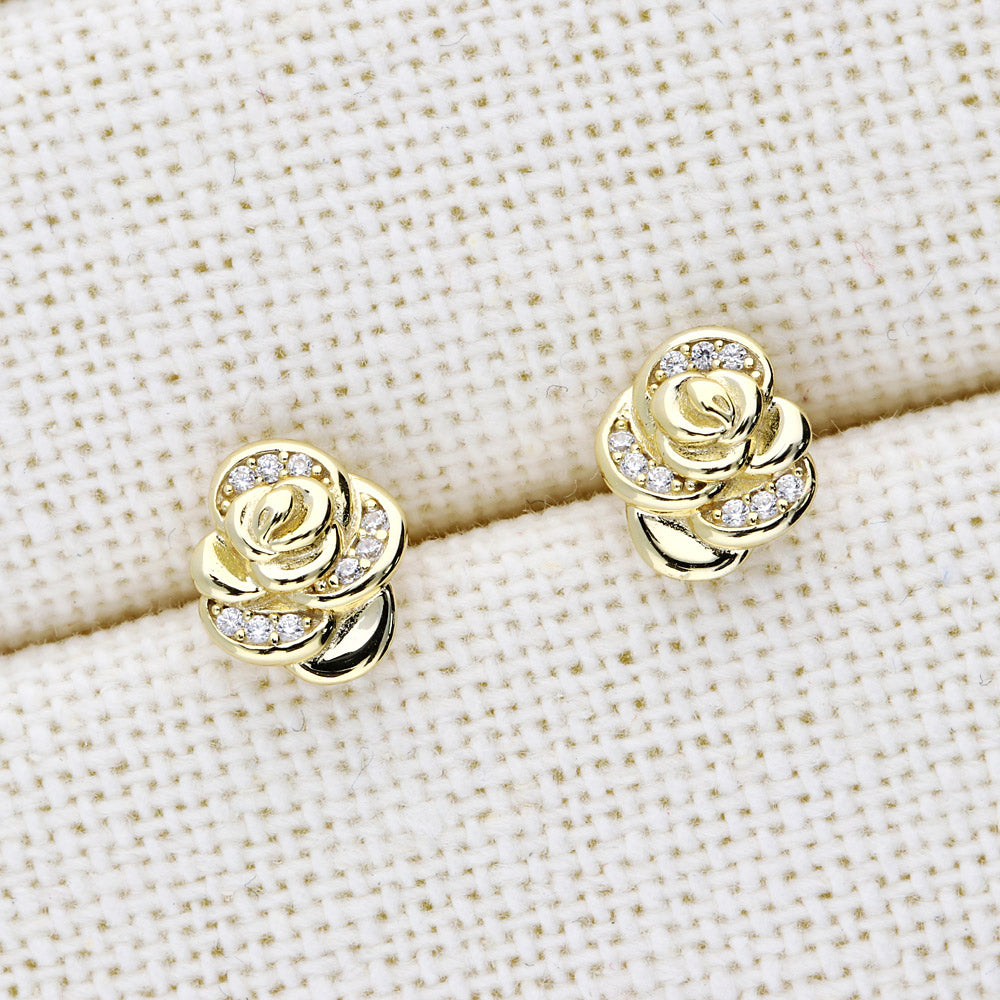 Flatlay view of Rose Flower CZ Cartilage Stud Earrings in Sterling Silver, Yellow Gold Flashed