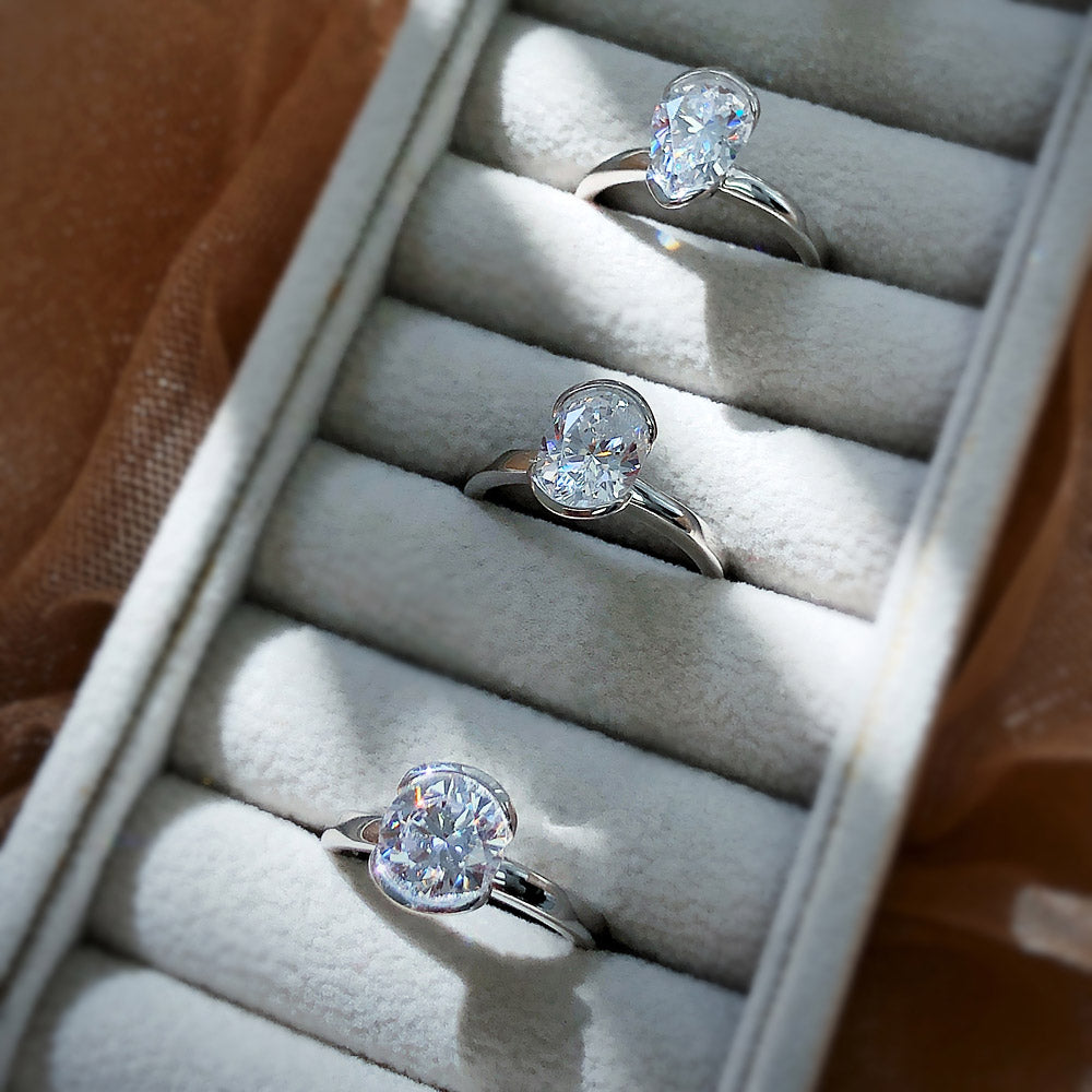 Flatlay view of Solitaire 1.8ct Bezel Pear CZ Ring in Sterling Silver, 9 of 10