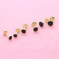 Flatlay view of Martini Solitaire Bezel CZ Stud Earrings, Gold Flashed, Black / 4mm