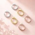 Angle view of Oval CZ Small Inside-Out Hoop Earrings in Sterling Silver 0.8 inch