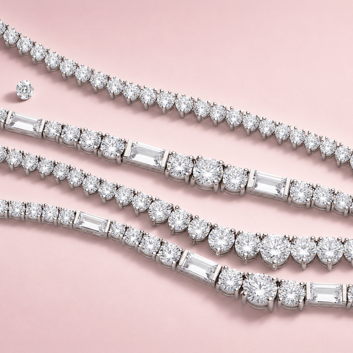Cubic Zirconia tennis necklaces on a pink background