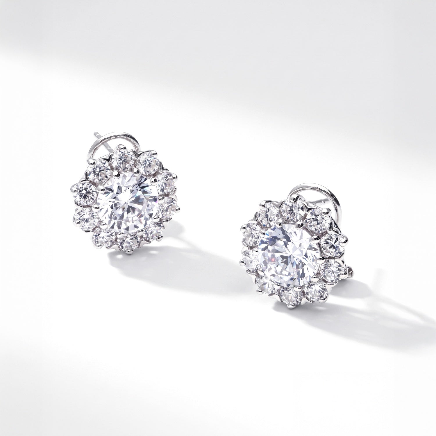 Side view of Flower Halo CZ Omega Back Stud Earrings in Sterling Silver, 4 of 7