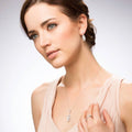 Model wearing Halo Art Deco Marquise CZ Earrings in Sterling Silver, Sapphire Color