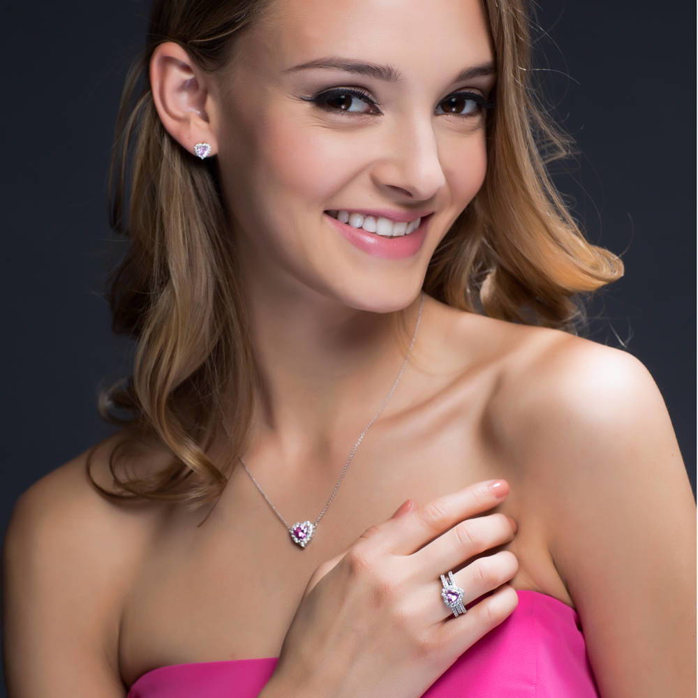 Model wearing Halo Heart Heart CZ Stud Earrings in Sterling Silver, 9 of 19