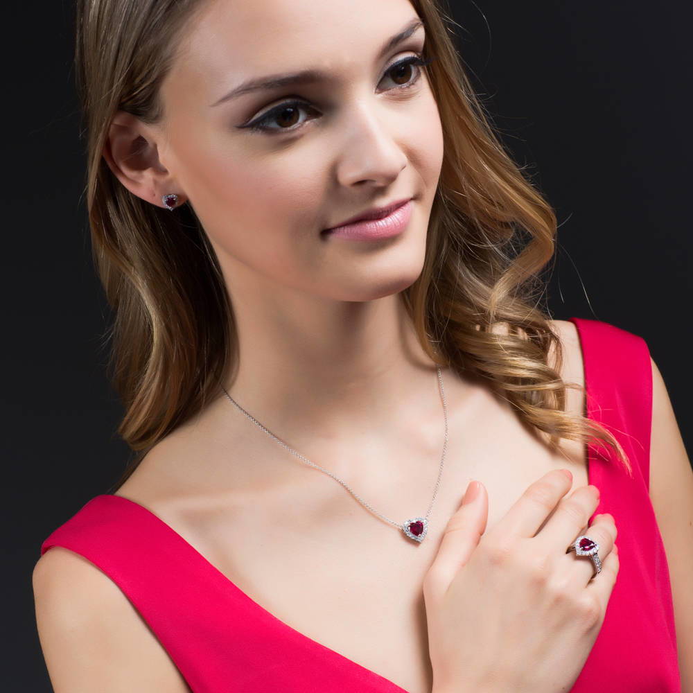 Model wearing Halo Heart Ruby-Red Heart CZ Ring Set in Sterling Silver, 10 of 10