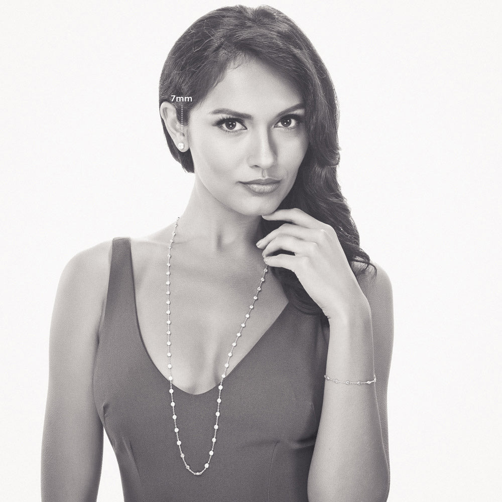 Model wearing Martini Solitaire Bezel CZ Stud Earrings, Rhodium Plated, Clear / 7mm