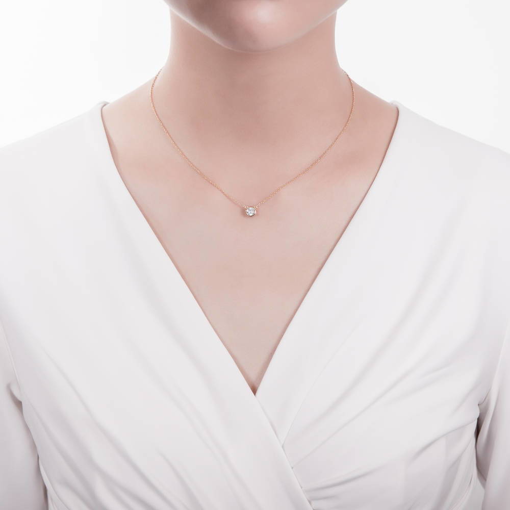 Model wearing Solitaire 0.45ct Bezel CZ Necklace in Sterling Silver, Yellow Gold Flashed