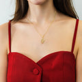 Model wearing Snake CZ Necklace and Earrings in Sterling Silver, Gold Flashed