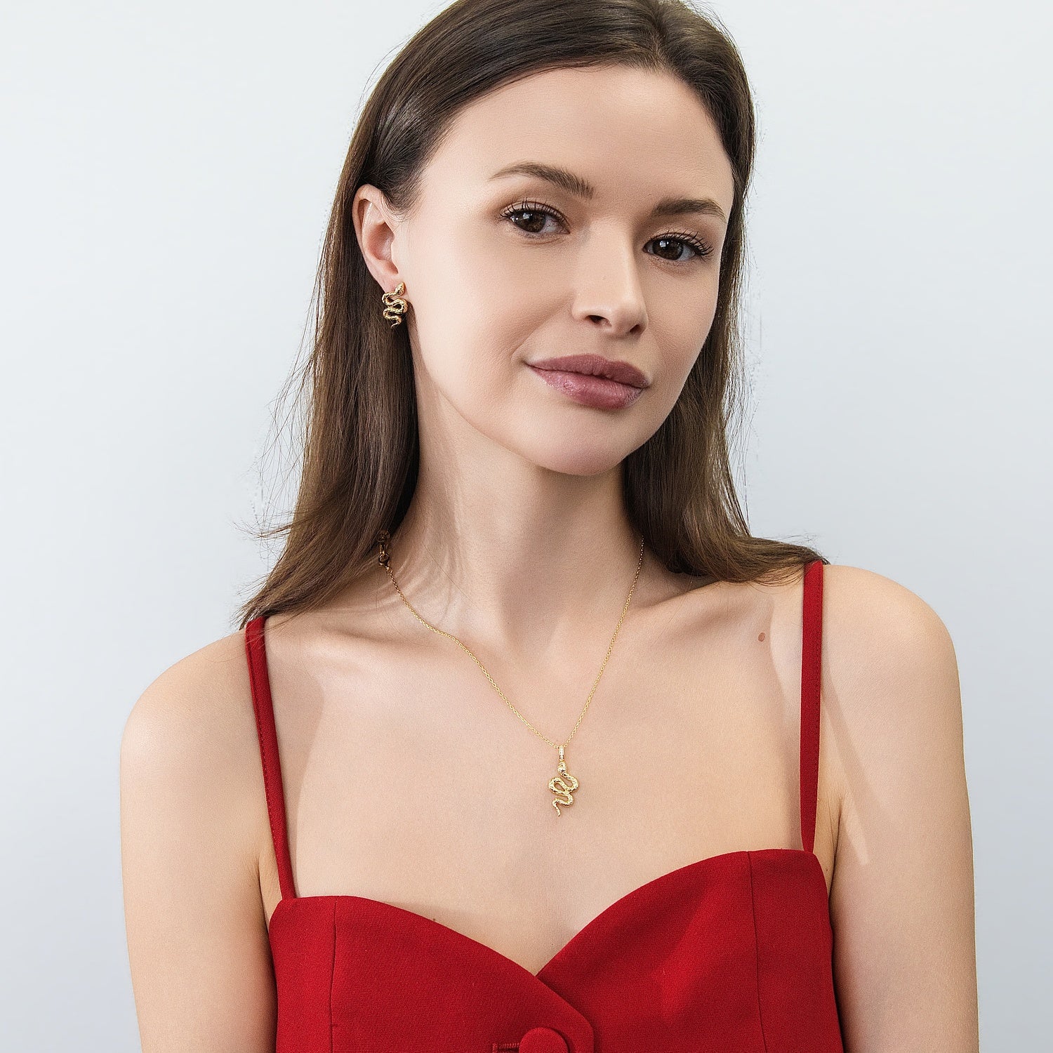 Model wearing Snake CZ Necklace and Earrings in Sterling Silver, Gold Flashed