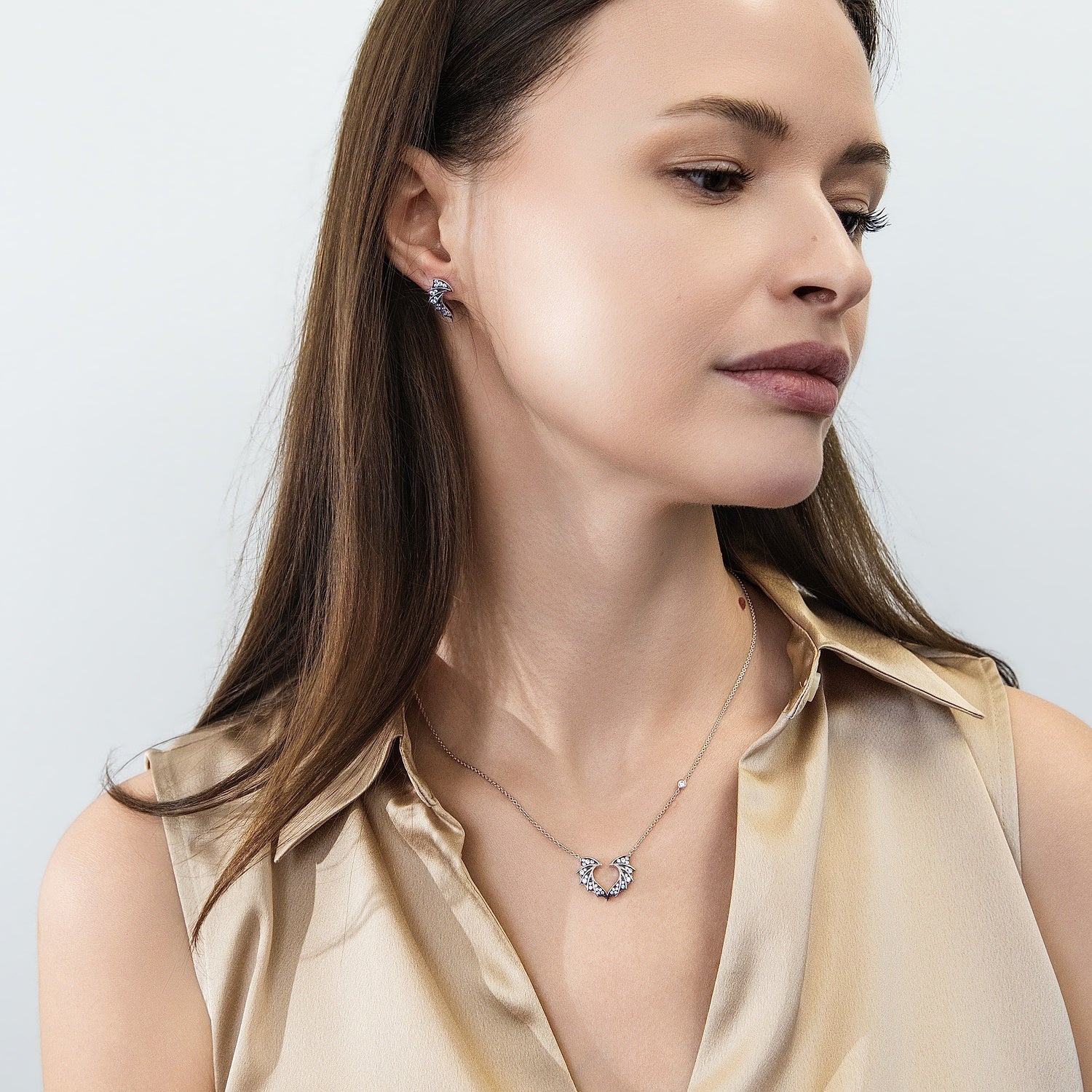 Model wearing Bat Wings CZ Necklace and Earrings in Sterling Silver, 9 of 11