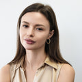 Model wearing CZ Small Hoop Earrings in Sterling Silver, 1 inch, Gold Flashed