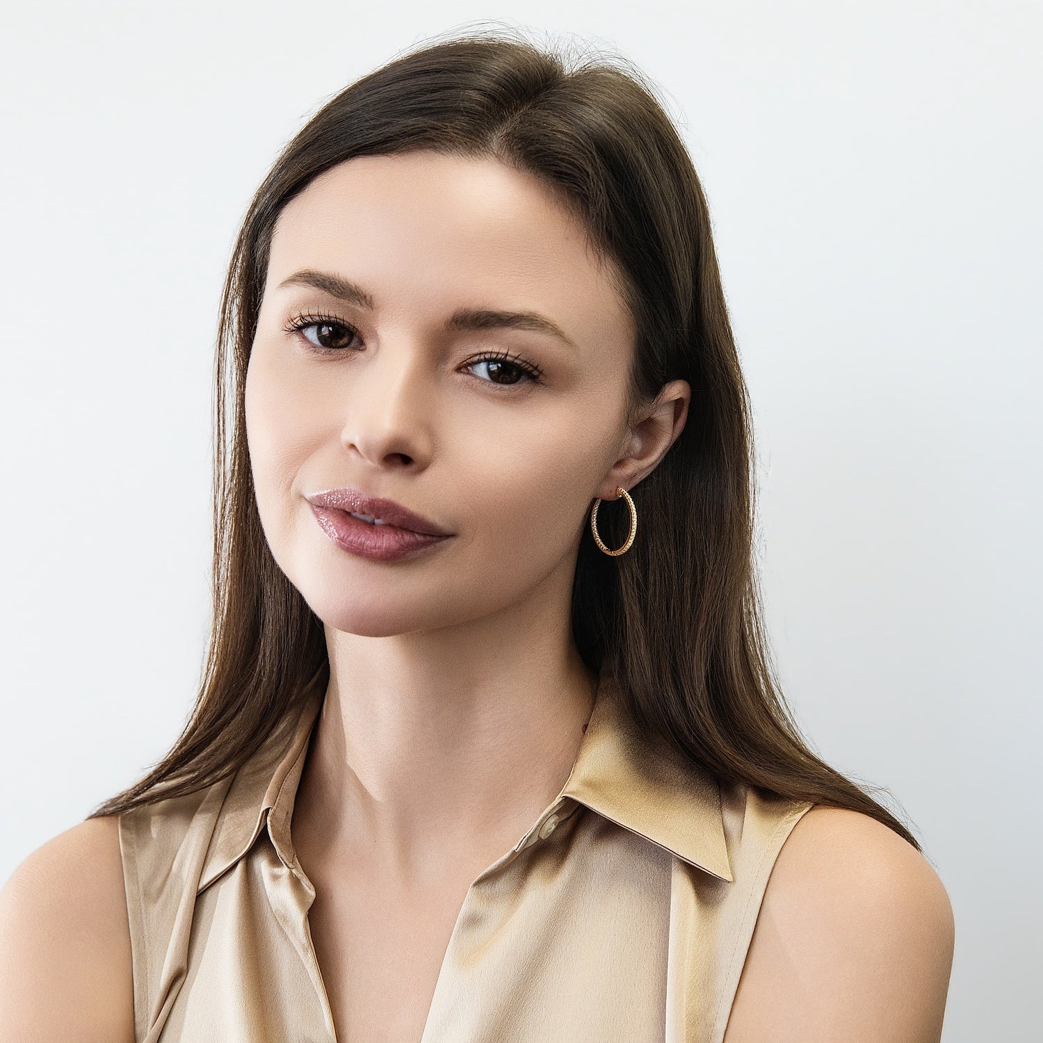 Model wearing CZ Small Hoop Earrings in Sterling Silver, 1 inch, Gold Flashed