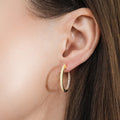 Model wearing CZ Small Hoop Earrings in Sterling Silver, 0.9 inch, Gold Flashed