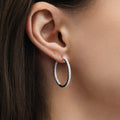 Model wearing CZ Small Hoop Earrings in Sterling Silver, 1 inch