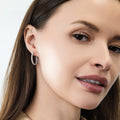 Model wearing CZ Small Hoop Earrings in Sterling Silver, 0.9 inch