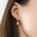 Model wearing Solitaire 1.6-2.6ct Pear CZ Leverback Earrings in Sterling Silver, Clear, Gold Flashed