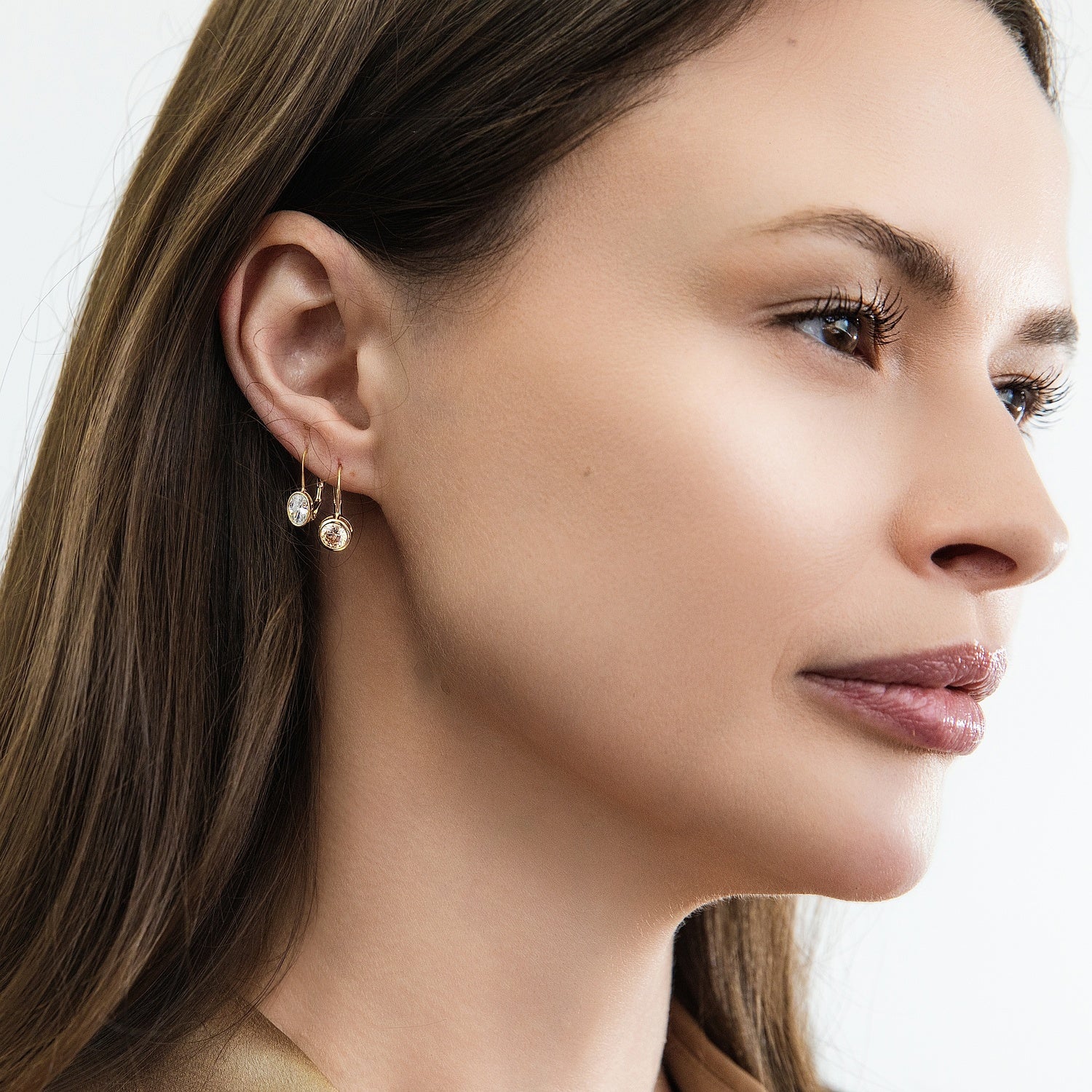 Model wearing Solitaire 1.2ct Bezel CZ Leverback Earrings in Sterling Silver, Champagne, Gold Flashed
