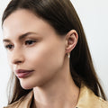 Model wearing Solitaire Oval Oval CZ Leverback Earrings in Sterling Silver, Gold Flashed