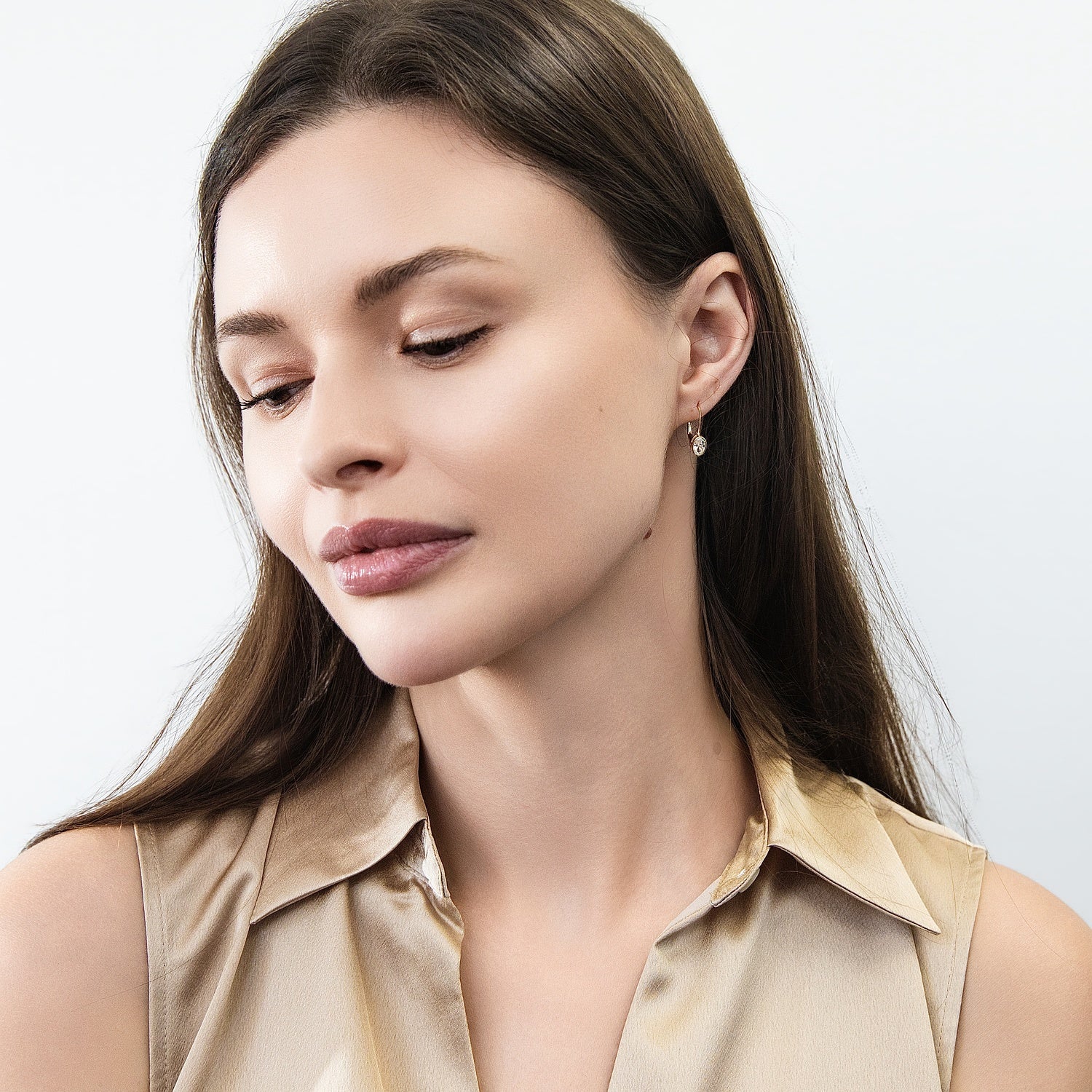 Model wearing Solitaire Oval Oval CZ Leverback Earrings in Sterling Silver, Gold Flashed