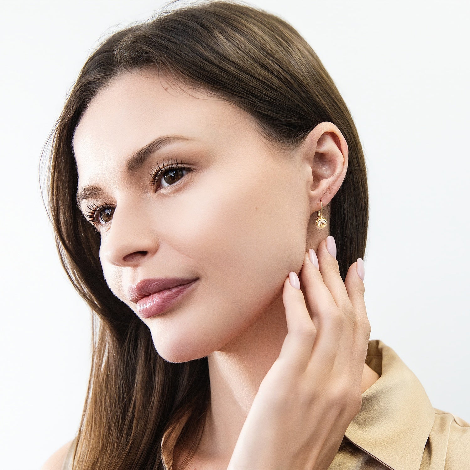 Model wearing Solitaire 1.2ct Bezel CZ Leverback Earrings in Sterling Silver, Champagne, Gold Flashed