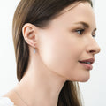 Model wearing Solitaire Oval Oval CZ Leverback Earrings in Sterling Silver, Rhodium Plated
