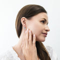 Model wearing Solitaire 1.2ct Bezel CZ Leverback Earrings in Sterling Silver, Clear