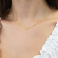 Model wearing Solitaire Bezel CZ Necklace in Sterling Silver, Gold Flashed