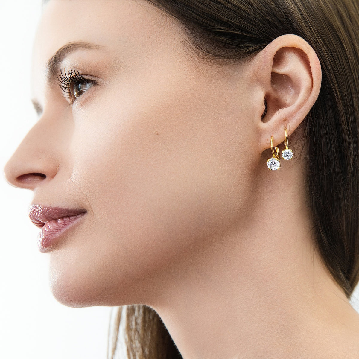 Model wearing Solitaire CZ Leverback Earrings in Sterling Silver, Gold Plated / 5mm