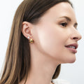 Model wearing Solitaire CZ Stud Earrings in Gold Flashed Sterling Silver, 5mm