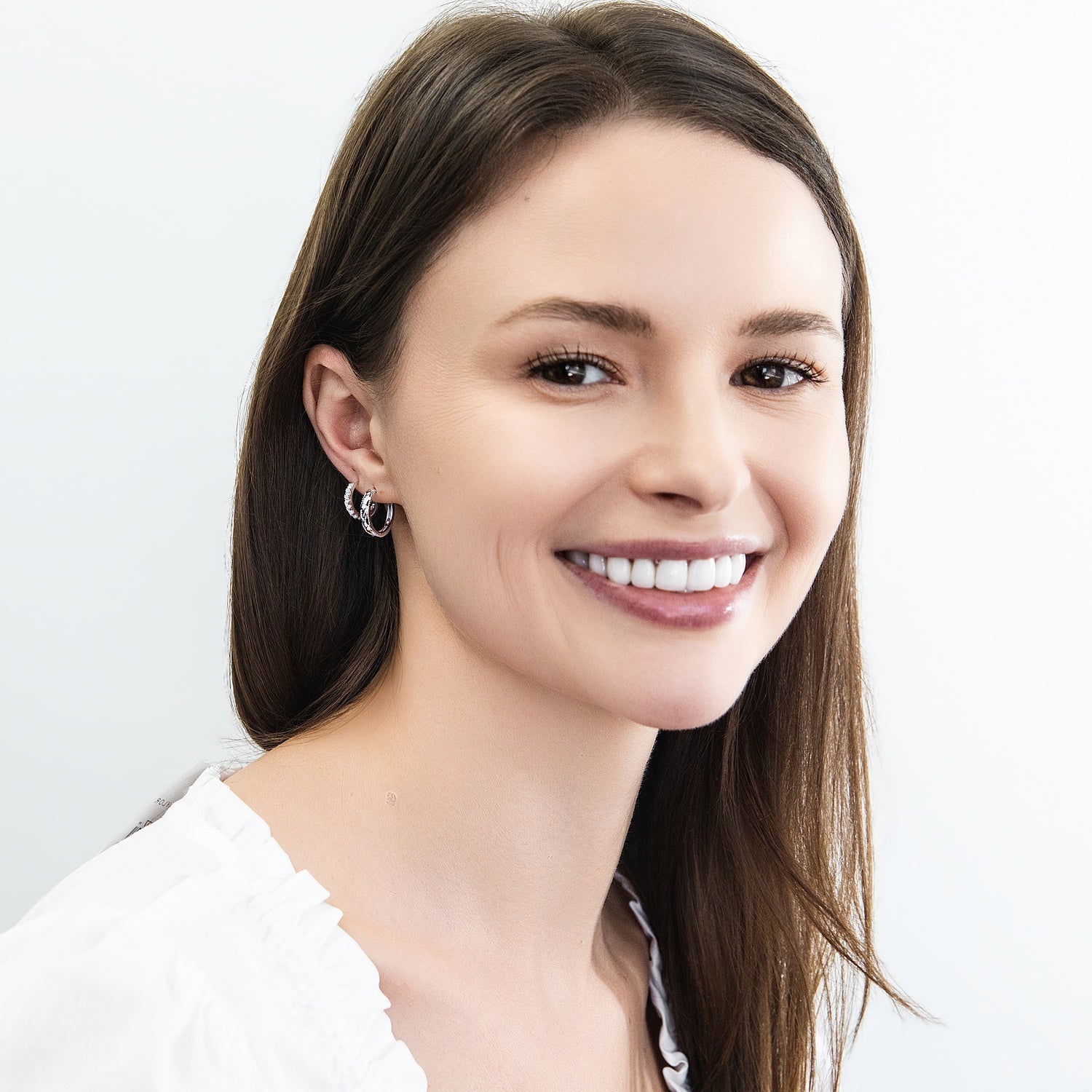 Model Wearing 7-Stone Hoop Earrings Style E1585-01, Woven Hoop Earrings Style E1892-01